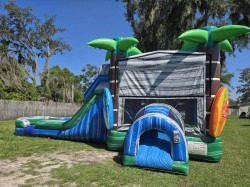 Tropical Surf bounce house rental with slide